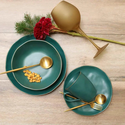 Pine Green ceramic soup bowls set of 4 with gold-tone spoons on rustic table on Tampa Home & Garden Store