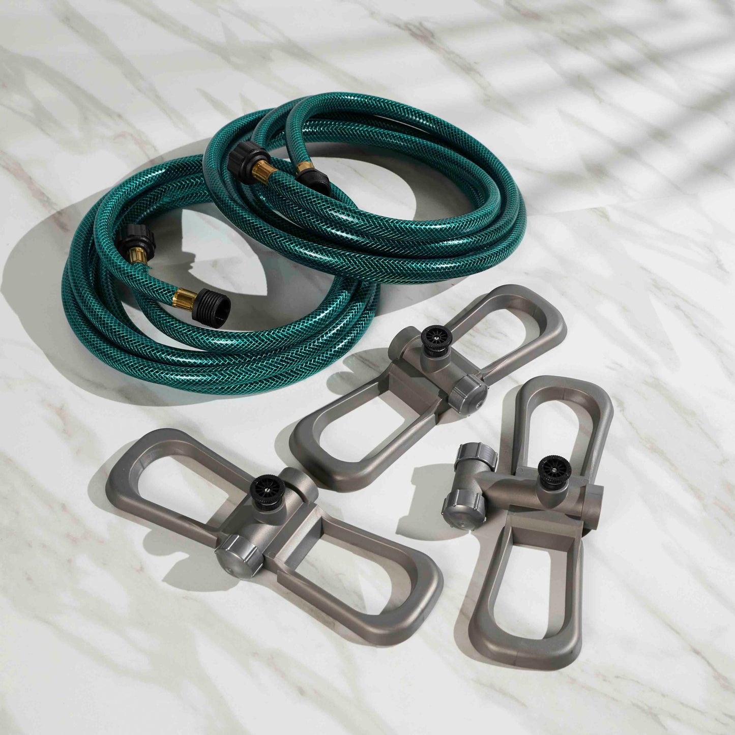 Port-a-Rain Watering System Portable Sprinkler with green braided hose and brass fittings on Tampa Home & Garden Store