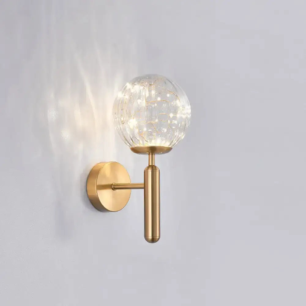 Brass-finish wall sconce with a clear crackle glass globe, single light on Tampa Home & Garden Store