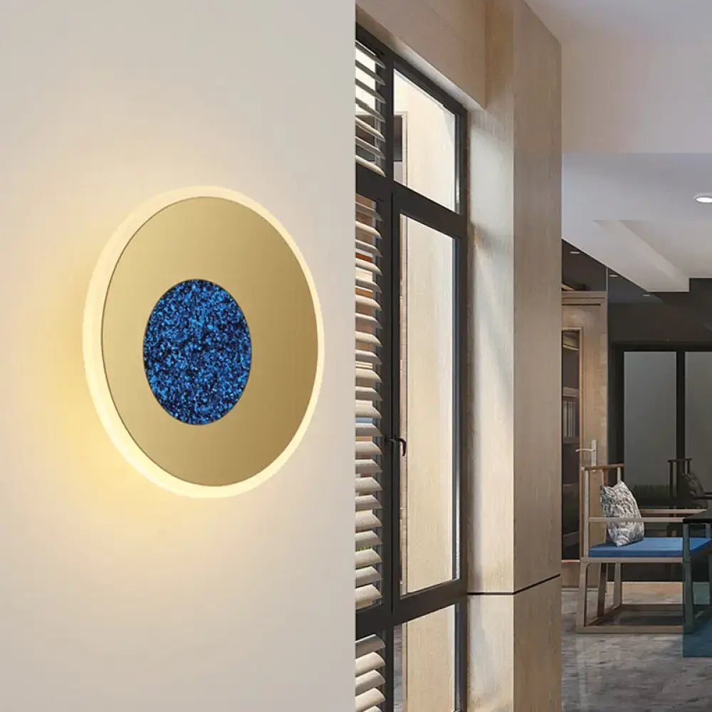 Blue round wall sconce by Decorbites with cream bezel and speckled blue center, 8β11 inch on Tampa Home & Garden Store