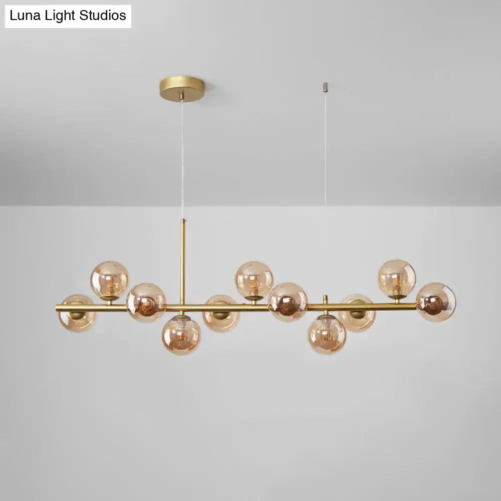 Postmodern glass ball pendant light by Decorbites in brass with amber glass globes for kitchen on Tampa Home & Garden Store