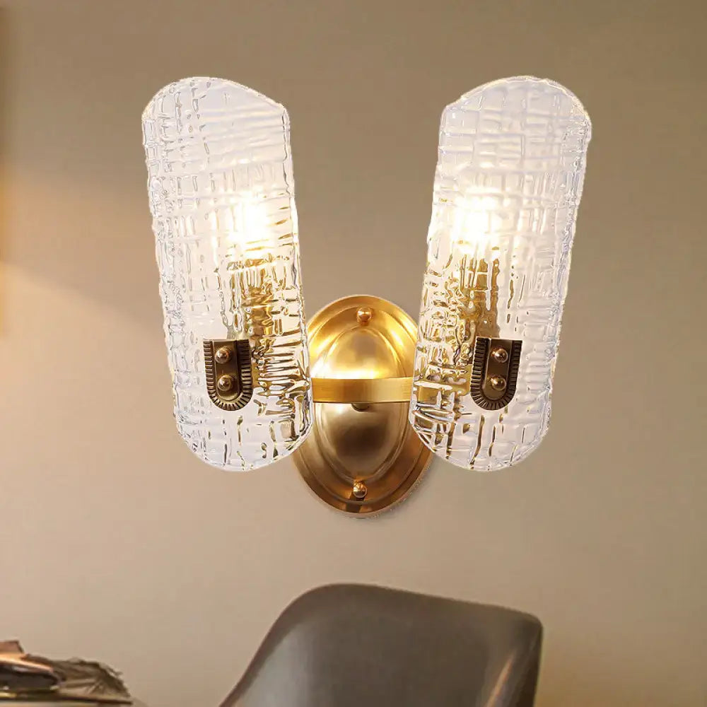 Gold prism glass sconce with two textured glass shades in a brass finish by Decorbites on Tampa Home & Garden Store