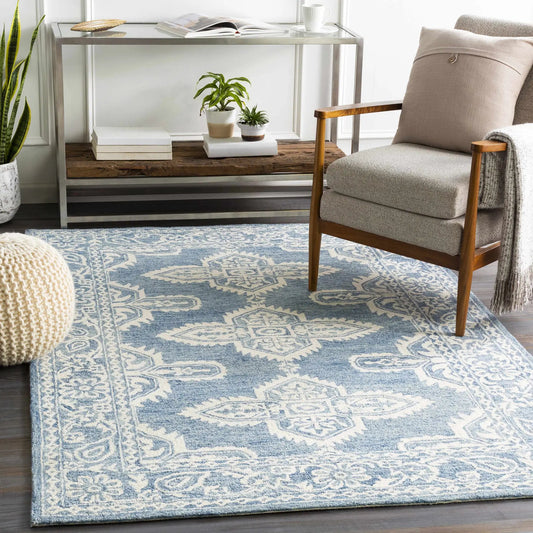 Passaic blue hand tufted wool rug by Boutique Rugs with ivory pattern on Tampa Home & Garden Store