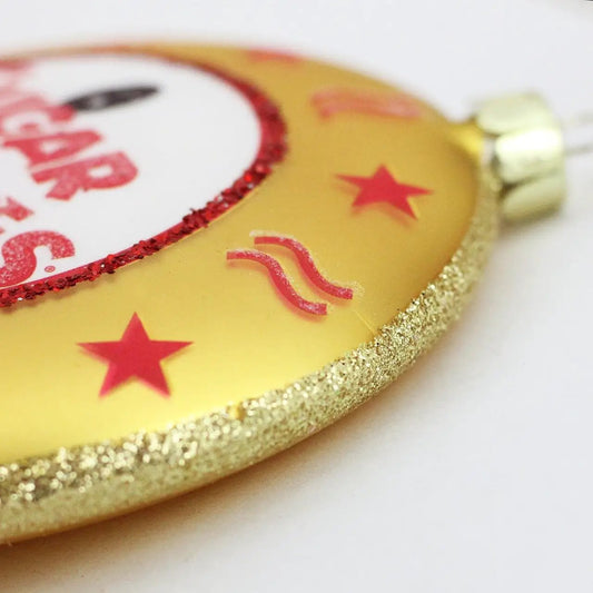 Tootsie Roll Gold Sugar Babies ornament with white center, red glitter ring, gold rim on Tampa Home & Garden Store