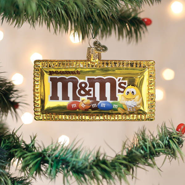 Peanut M&M's Glass Ornament with a gold frame and colorful M&M's logo for holiday decor on Tampa Home & Garden Store