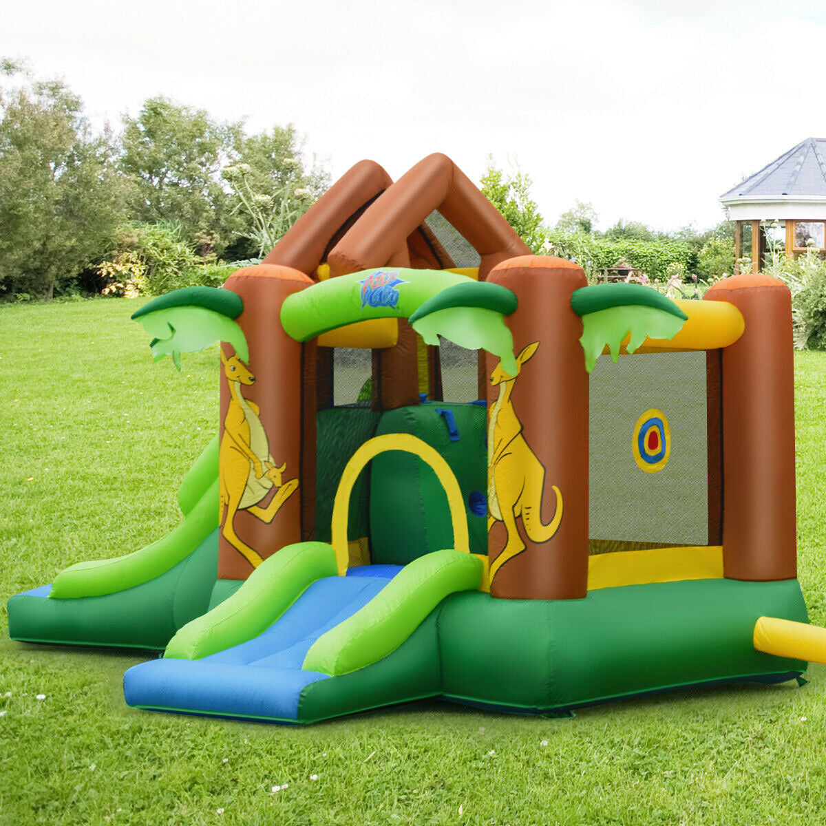 Kids Inflatable Jungle Bounce House Castle with green and blue slides and palm accents on Tampa Home & Garden Store