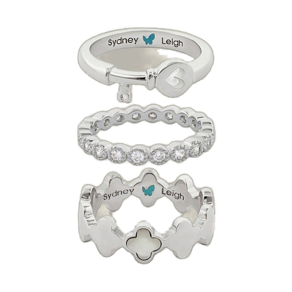 Set of 3 Sydney Leigh rings in silver tones: heart key charm, pavé band, and clover motif on Tampa Home & Garden Store