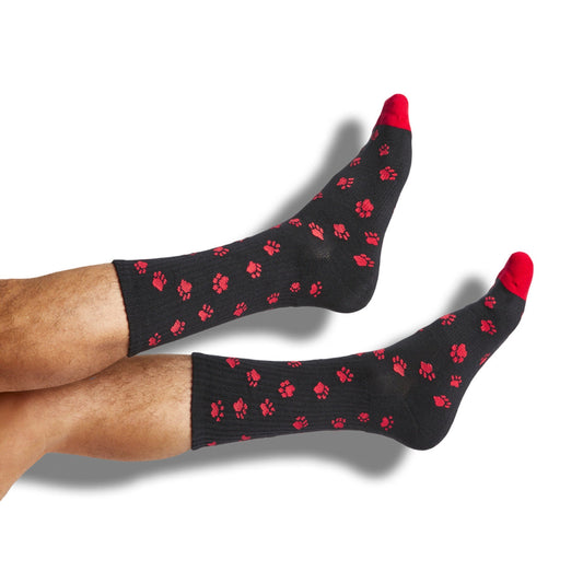 DeadSoxy red/black paw-print crew socks with red toes, shown on legs on Tampa Home & Garden Store