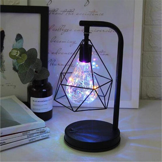 Stevvex table lamp with geometric iron cage and LED teardrop globe in black finish on Tampa Home & Garden Store