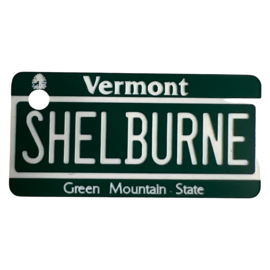 Shelburne Vermont license plate keychain green metal plate with white lettering on Tampa Home & Garden Store