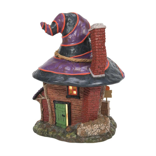 Trixies Tricks and Treats Lighted Witch Hollow village with purple and black witch hat roof on Tampa Home & Garden Store