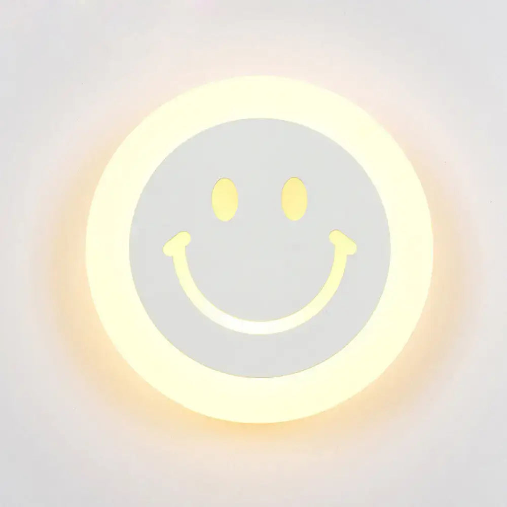LED Round Wall Sconce by Decorbites with glowing smiley-face design, warm white light on Tampa Home & Garden Store