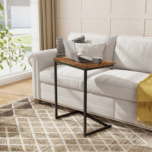 C-shaped end table with wood top and black metal frame beside a light gray sofa on Tampa Home & Garden Store