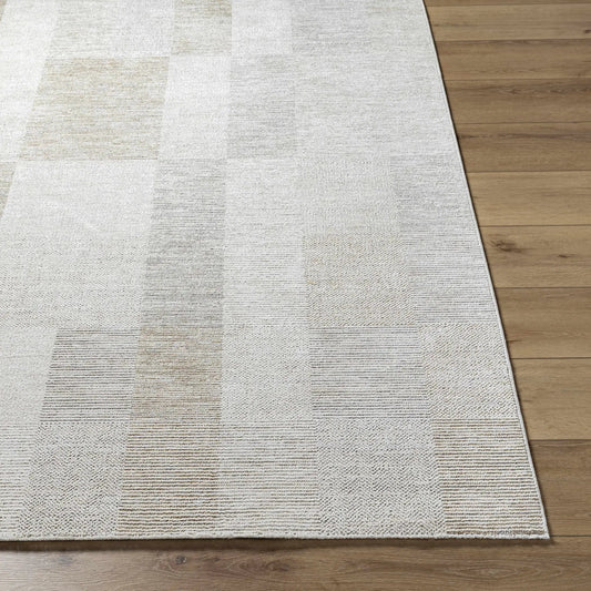 Radia Luxe Rug by Boutique Rugs in ivory and cream, traditional design on wood floor on Tampa Home & Garden Store