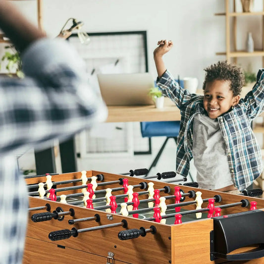 48-inch wood-finish 3-in-1 multi-game table with foosball soccer; child celebrates nearby on Tampa Home & Garden Store