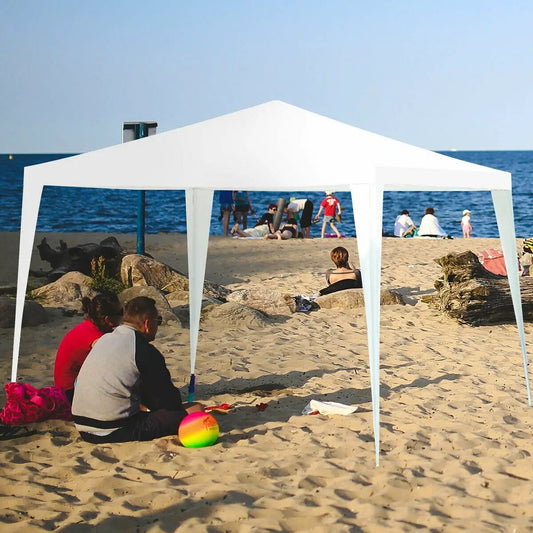 White outdoor canopy tent with four removable sidewalls on a sunny beach on Tampa Home & Garden Store