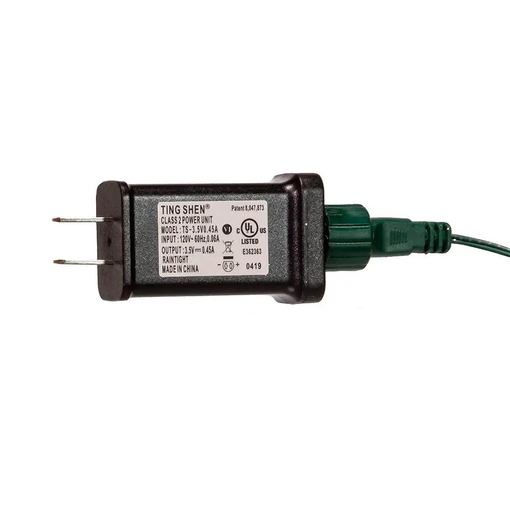 Inline power adapter with two-prong plug and green cord, Ting Shen label on Tampa Home & Garden Store