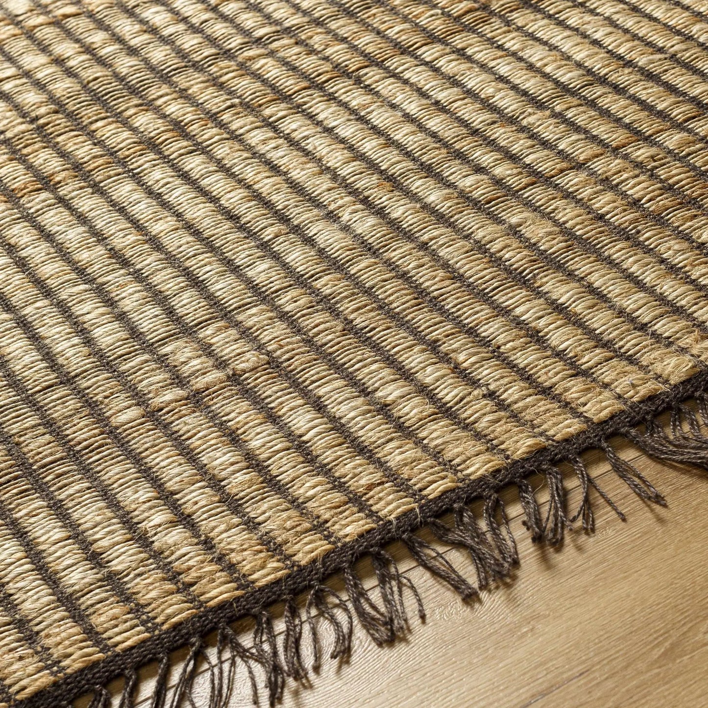 Mihal Jute Rug hand woven with tan beige and dark brown stripes and fringe on Tampa Home & Garden Store