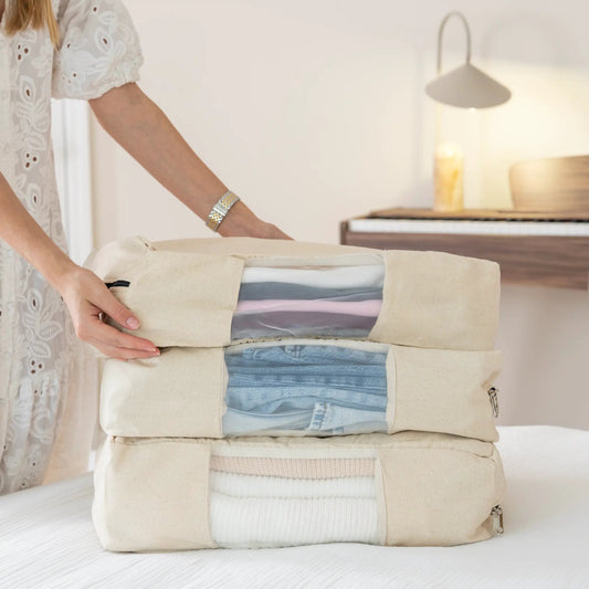 Cashmere storage bags set of five in beige canvas stacked with zip closures and garments on Tampa Home & Garden Store