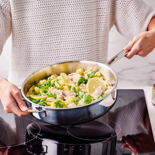 5-Ply stainless steel sauté pan with lid 4-Qt by Alva Cookware on stove on Tampa Home & Garden Store