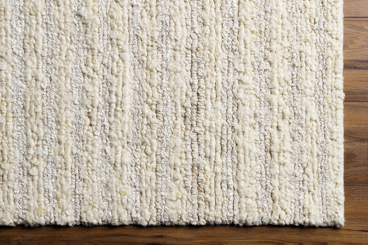Debra Area Rug from Boutique Rugs, ivory shag with chunky loops on wood floor on Tampa Home & Garden Store