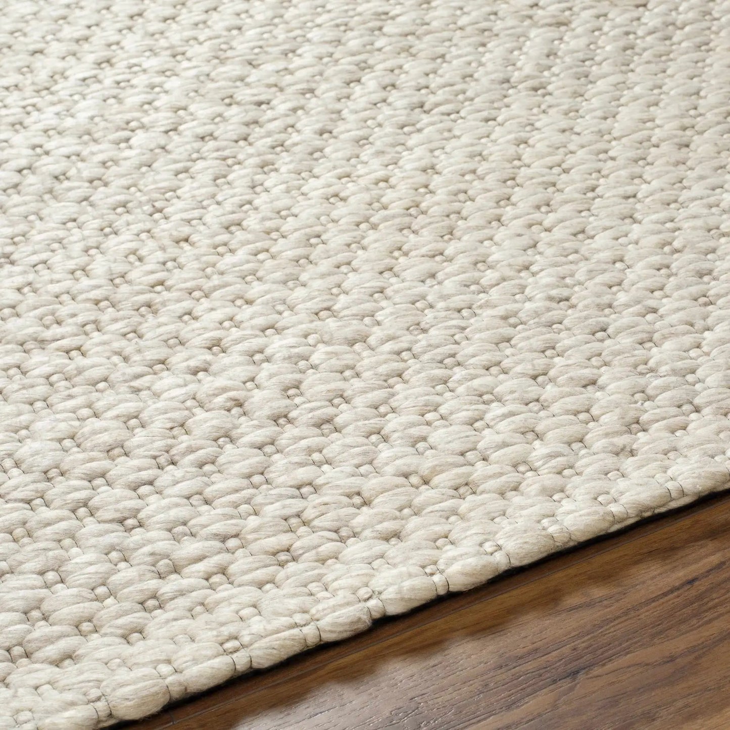 Kassa beige hand woven wool rug, textured chunky loops by Boutique Rugs on wood floor on Tampa Home & Garden Store
