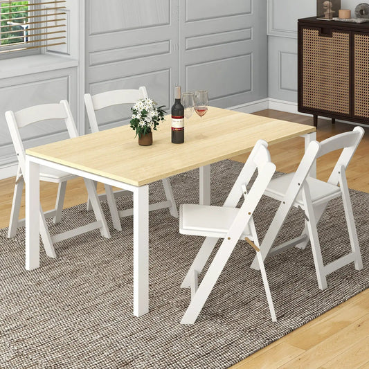 Foldable white dining chairs set of 4 with padded seats around a light wood dining table on Tampa Home & Garden Store