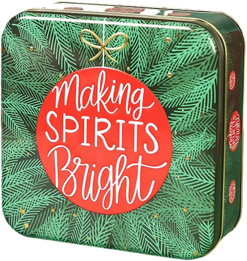 Making Spirits Bright Christmas cookie tin with green pine pattern and red label on Tampa Home & Garden Store