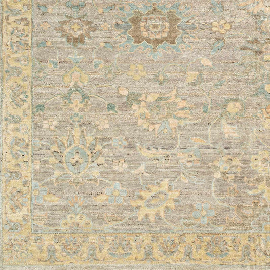 Cream Afia Area Rug by Boutique Rugs in distressed beige with blue and yellow floral motifs on Tampa Home & Garden Store