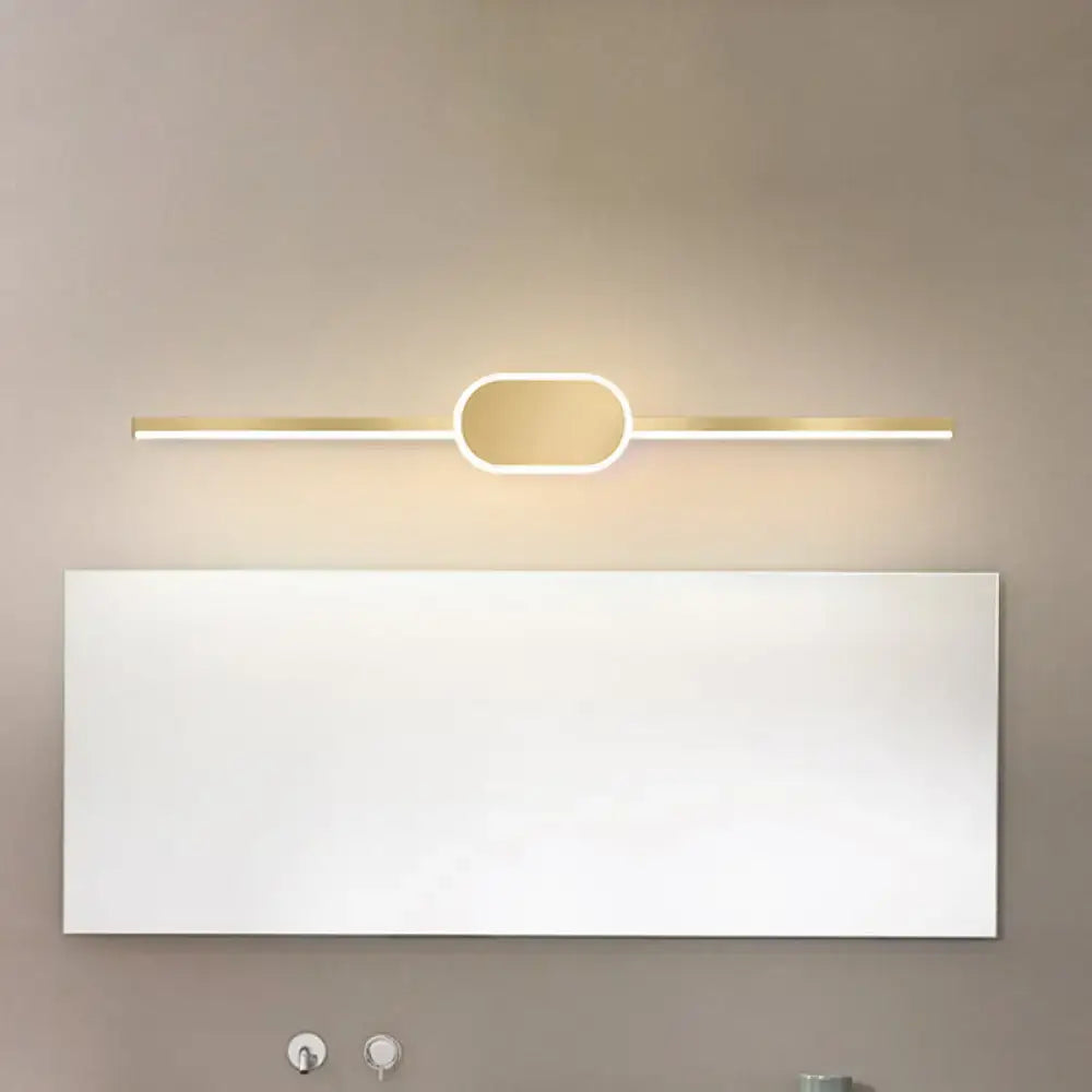 Gold metal 31-inch vanity sconce with a rounded central glow above a bathroom mirror on Tampa Home & Garden Store