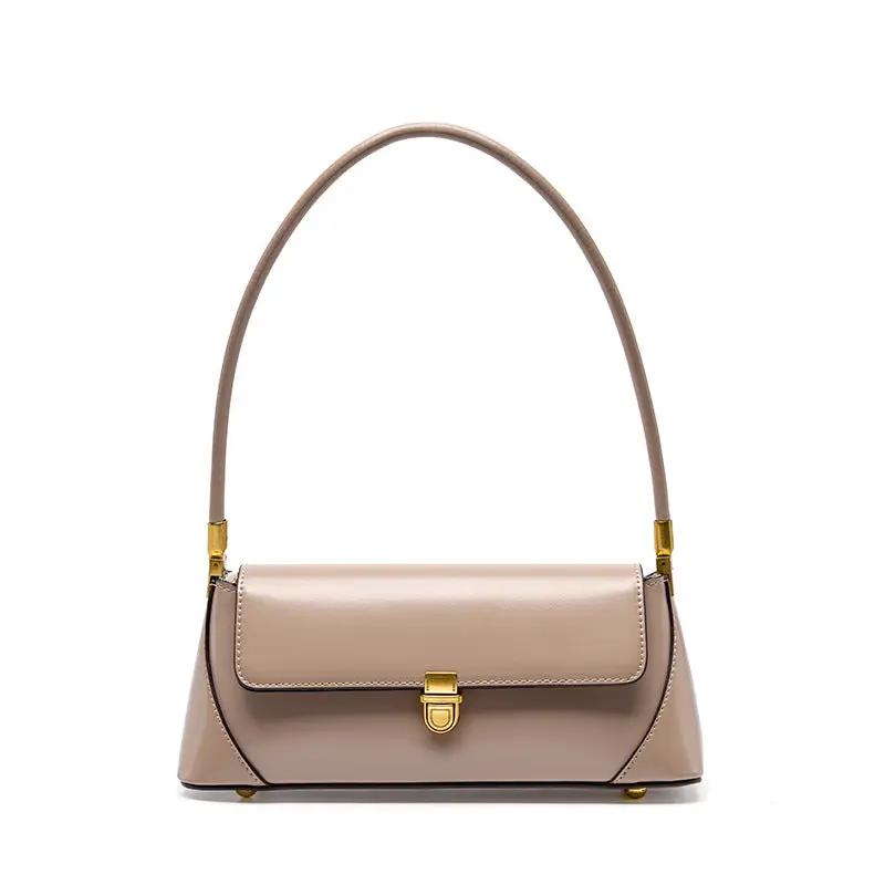 Small French leather baguette shoulder bag in taupe with a gold-tone clasp on Tampa Home & Garden Store