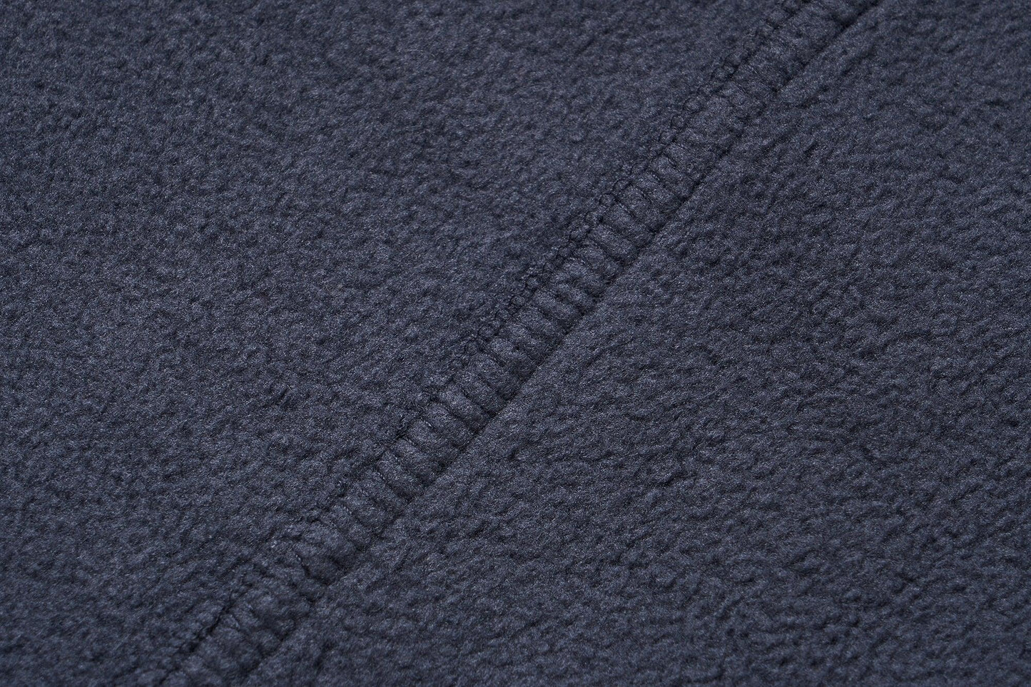 Stevvex navy fleece jacket fabric close-up with textured weave and diagonal seam on Tampa Home & Garden Store