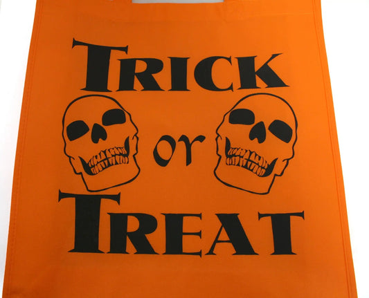 Trick or Treat Bag for Halloween roomy orange bag with bold black skull graphics on Tampa Home & Garden Store