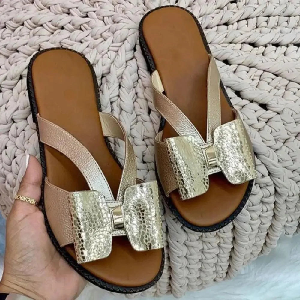 Stevvex Summer Butterfly sandals pair with metallic gold bows and beige straps on brown footbeds on Tampa Home & Garden Store