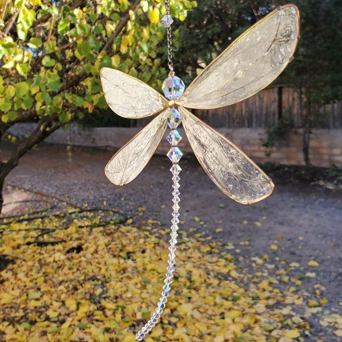Stevvex dragonfly wind chime sun catcher with gold-trimmed clear crystal wings and prism beads on Tampa Home & Garden Store