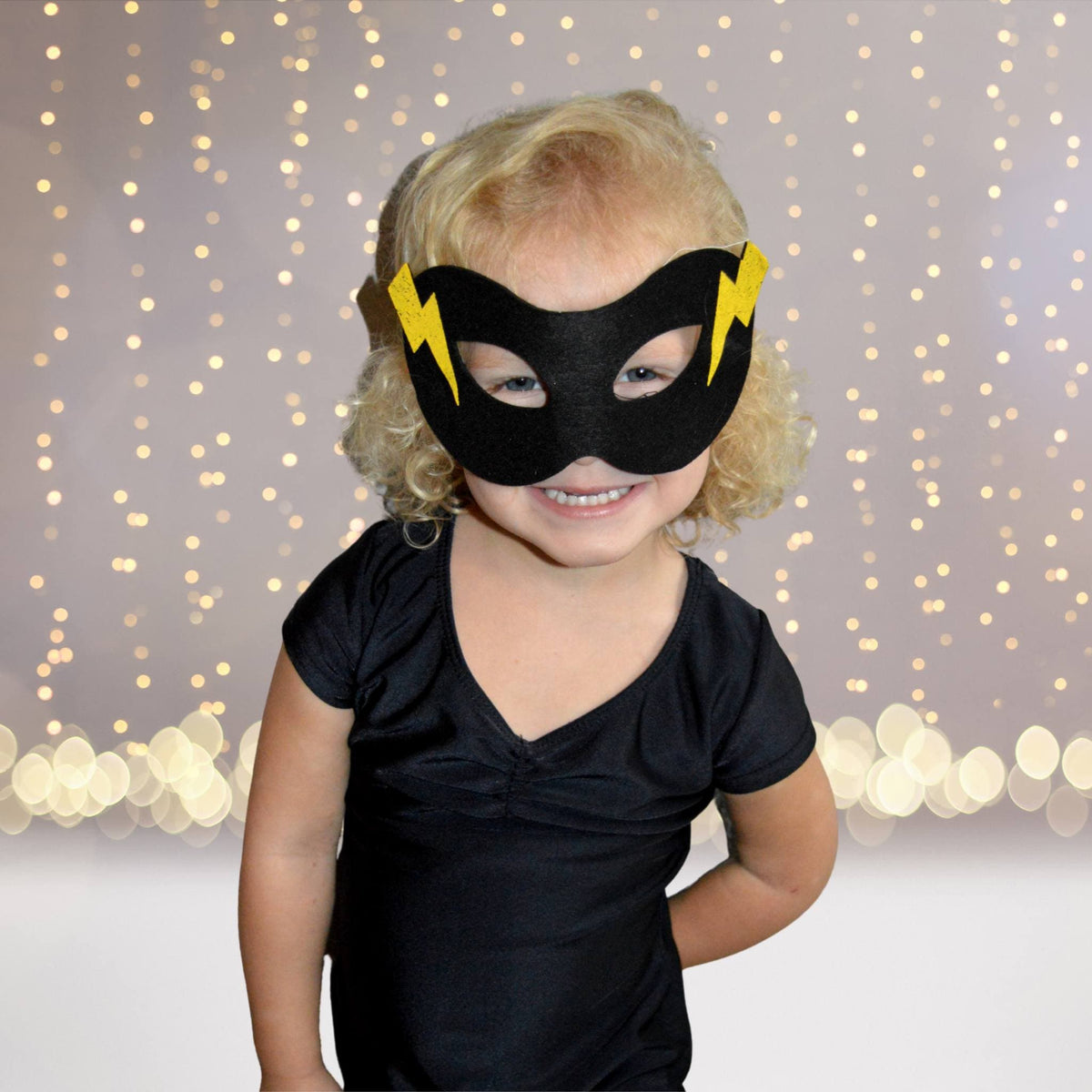 Superhero Teepee Play Set Child wearing black mask with yellow bolts for pretend play on Tampa Home & Garden Store
