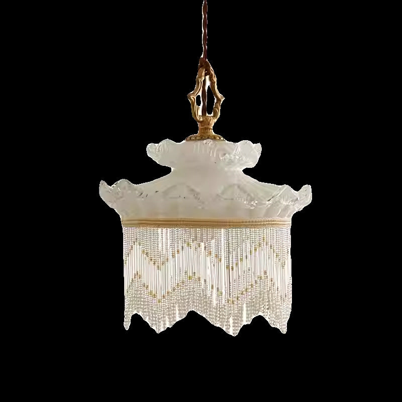 Tassel chandelier by Decorbites with ivory glass shade and beaded fringe, gold hardware on Tampa Home & Garden Store