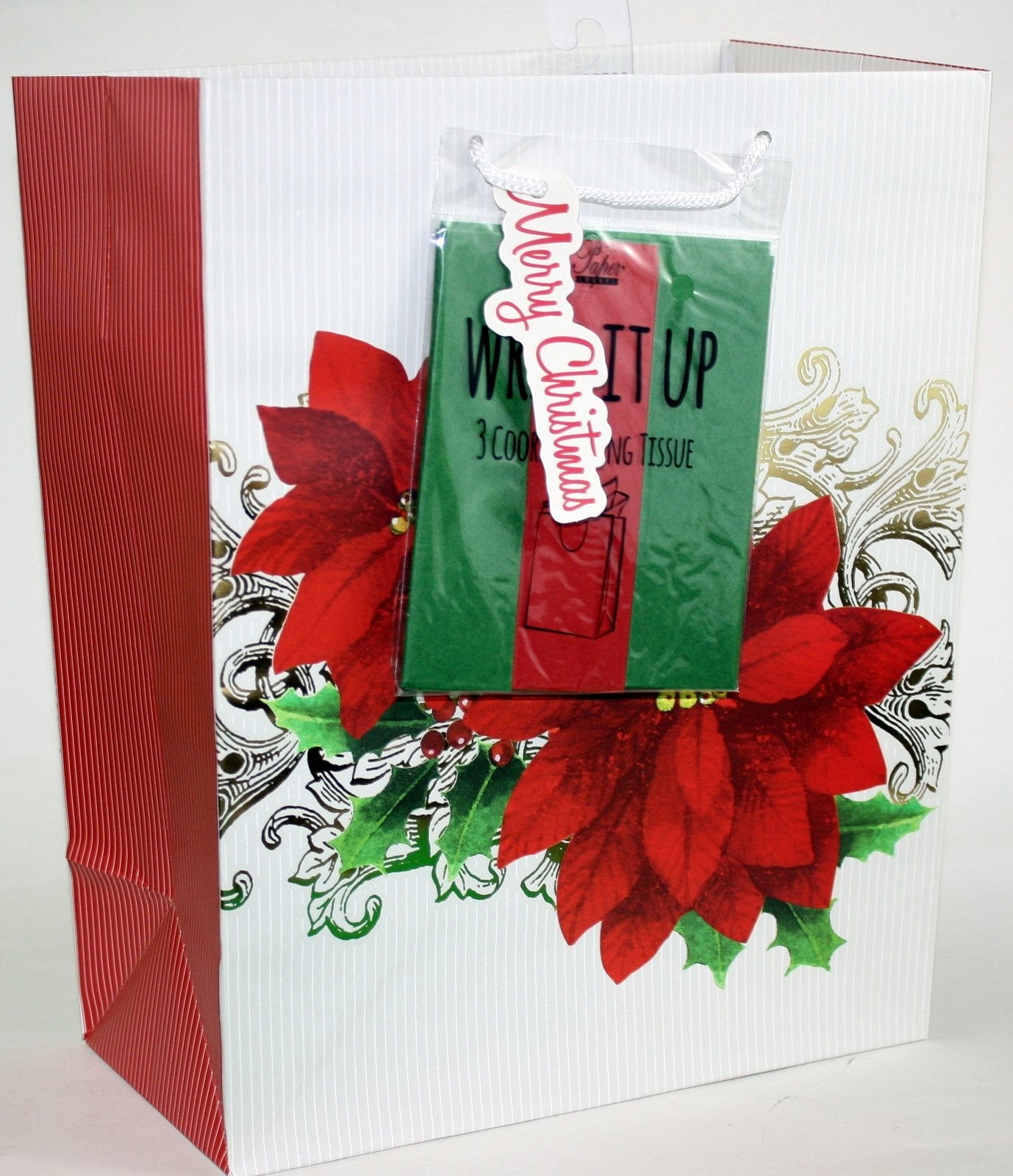 Gift bag with tissue featuring large red poinsettias on white striped bag with red side panel on Tampa Home & Garden Store