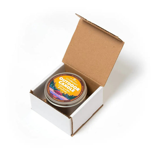 Outdoor citronella candle City Bonfires in metal tin with label S'mores scent in white box on Tampa Home & Garden Store