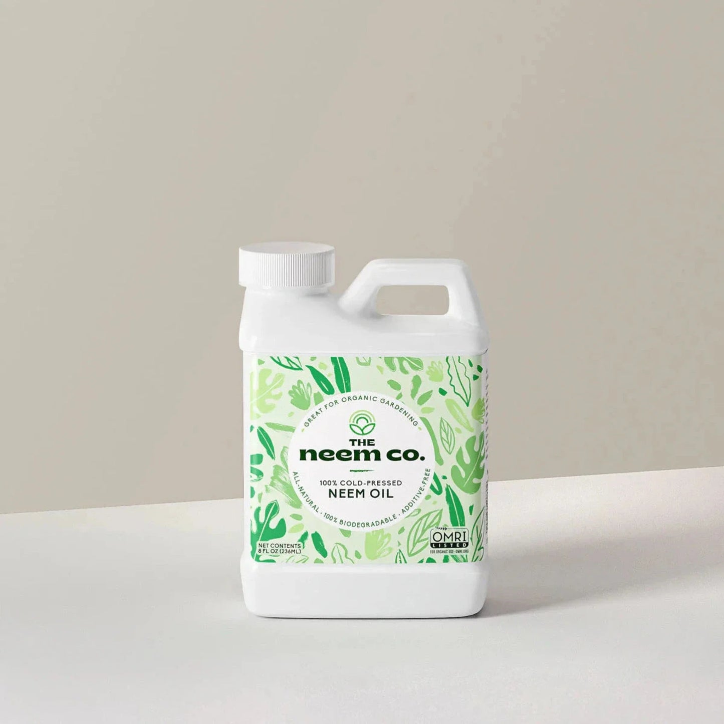 Organic Neem Oil bottle with green botanical label and The Neem Co. branding on Tampa Home & Garden Store