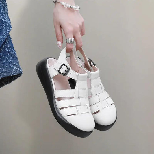 Women's white leather sandals with buckled wedge heel, strappy upper and chunky black sole on Tampa Home & Garden Store