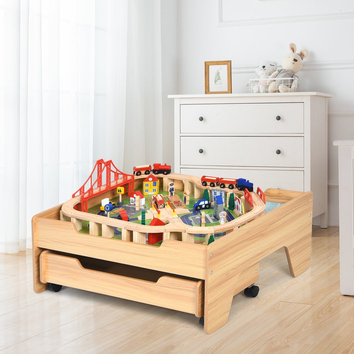 Children's wooden railway table with a 100-piece train set on a natural wood surface on Tampa Home & Garden Store