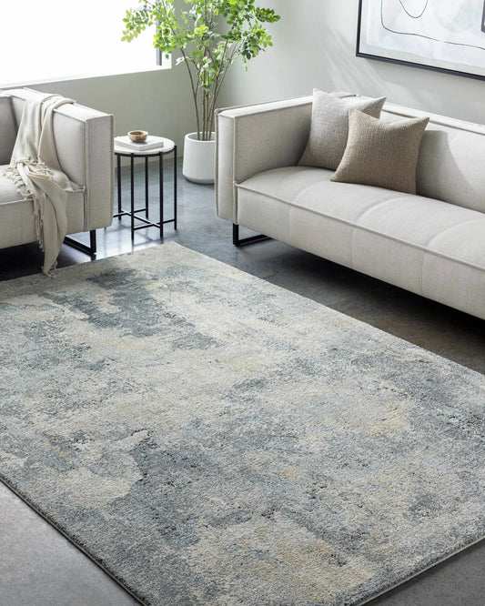 Adsila Teal Blue Thick Luxe Area Rug by Boutique Rugs in a living room with two gray sofas on Tampa Home & Garden Store