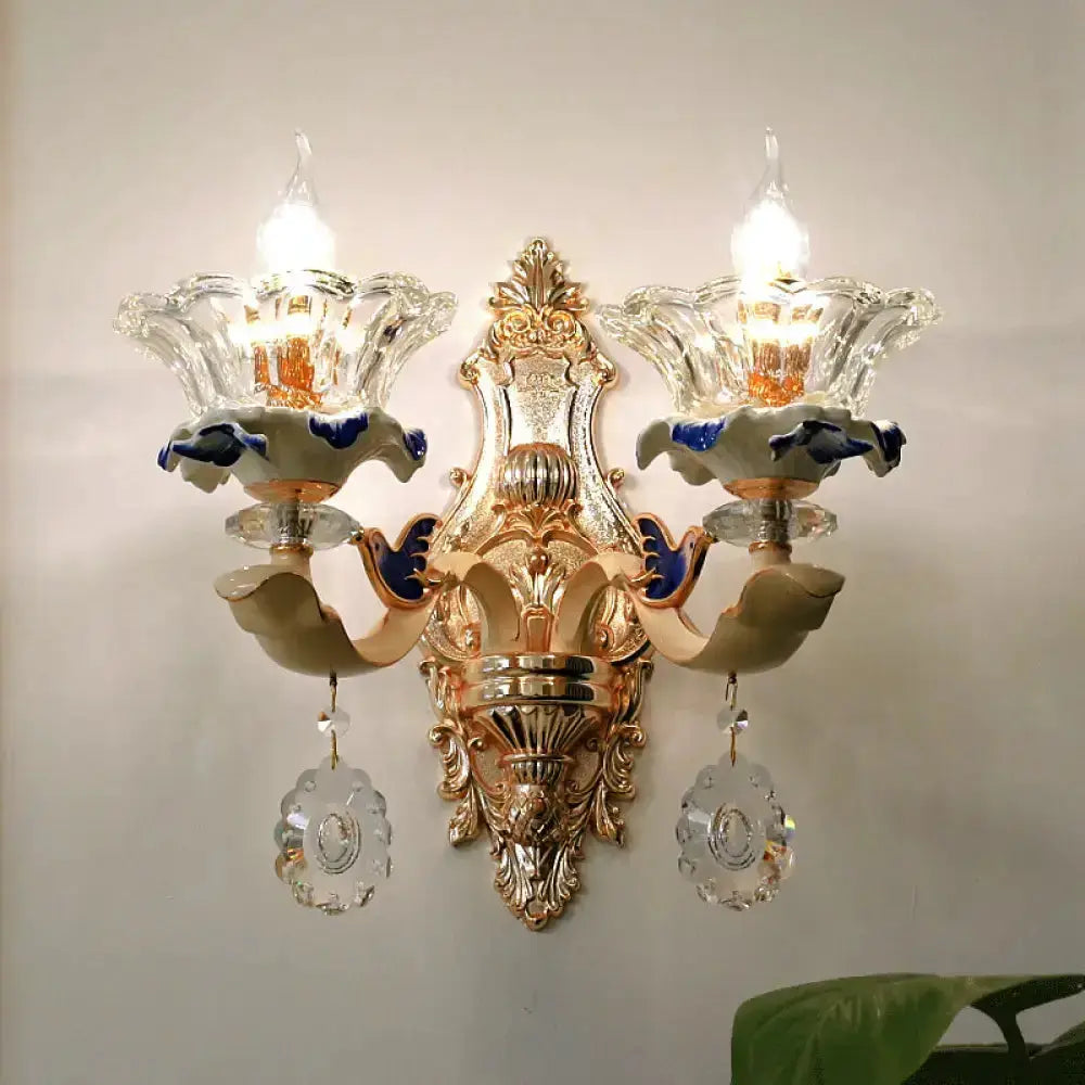 Two-light brass wall sconce with crystal flower shade by Decorbites, ornate vintage finish on Tampa Home & Garden Store