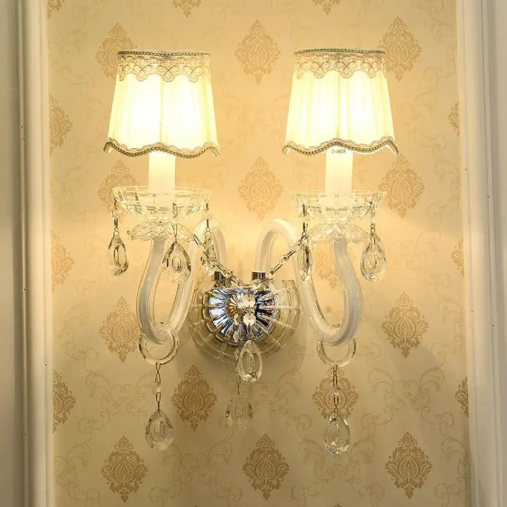 Traditional White Candle Wall Lamp with Clear Crystal Accent and Scalloped Fabric Shade