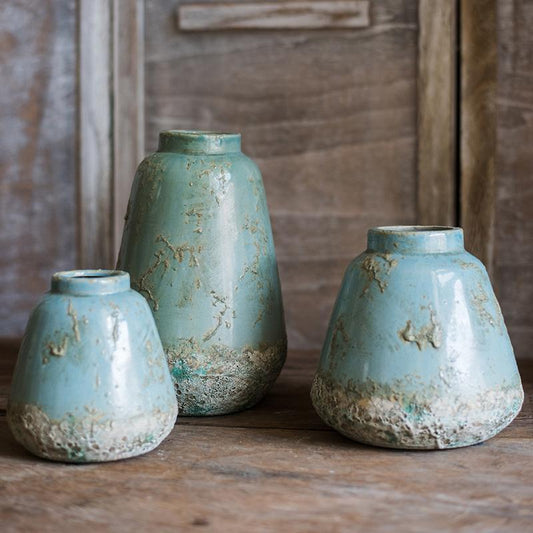 Three turquoise ceramic vases with rustic textured bases on Tampa Home & Garden Store