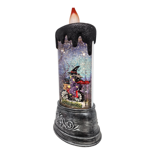 Enchanting Halloween Witch Water Globe Candle with black wax drips and glittery scene on Tampa Home & Garden Store