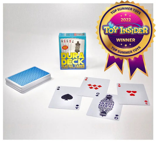 DuraDeck waterproof playing cards with blue box and blue-backed deck among scattered cards on Tampa Home & Garden Store