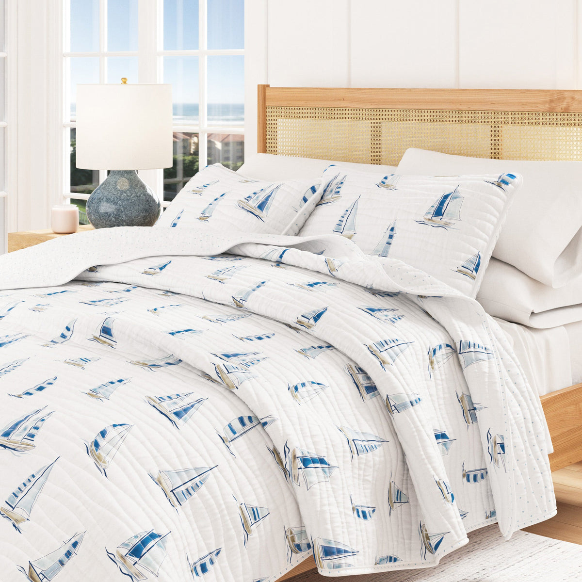 Coastal Blue Sailboat Quilt Set Great Bay Home white background with blue sailboat print on Tampa Home & Garden Store