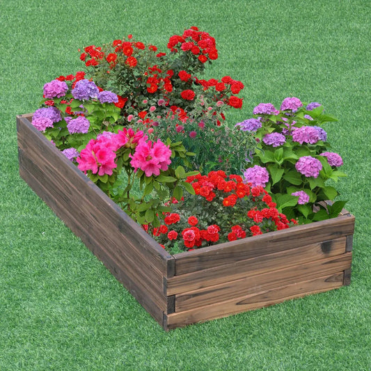 Elevated wooden garden planter box with red pink purple flowering plants on lawn on Tampa Home & Garden Store